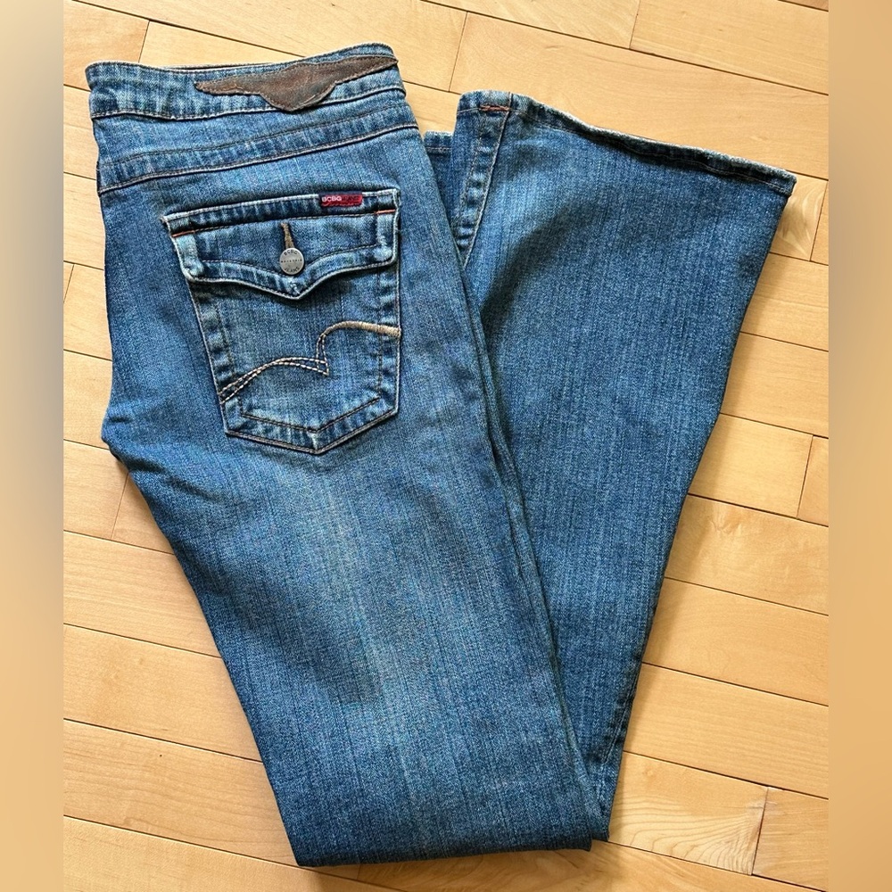 BCBG MaxAzria blue flare leg jeans with classic indigo hue